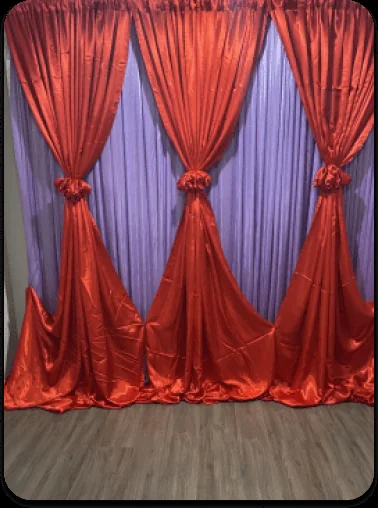 Red and purple draped backdrop
