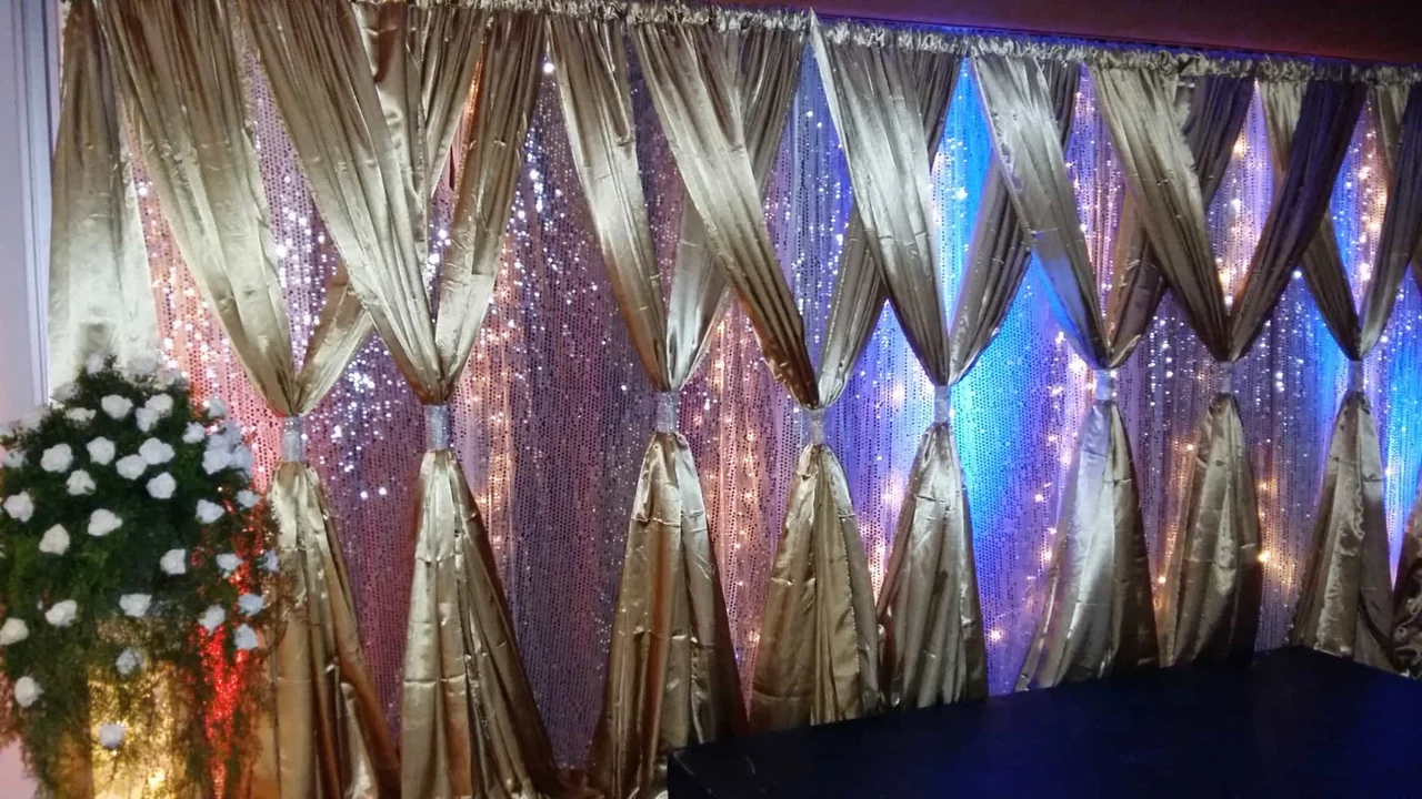 Sequin backdrop with coloured drapes