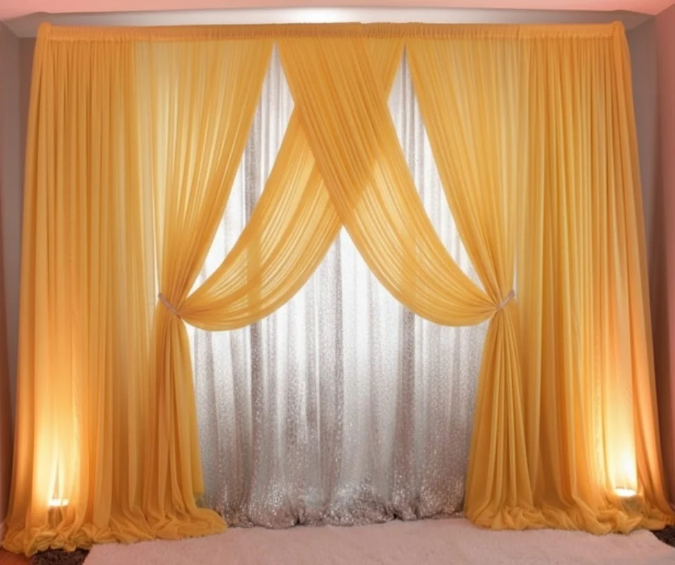 Yellow and white draped wedding backdrop