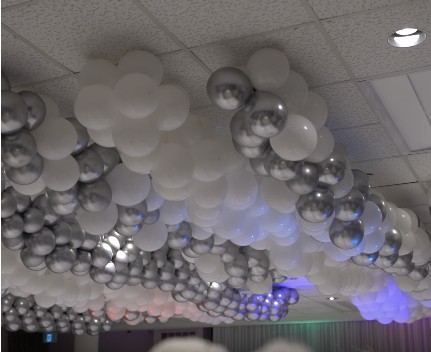 Cloud-style silver and white balloon installation on a ceiling
