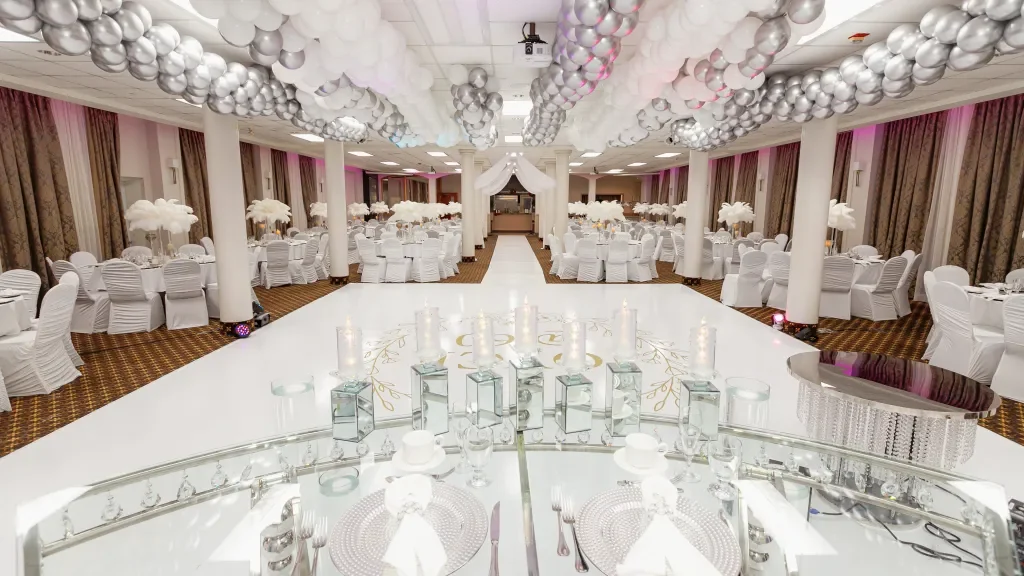 White reception tablescape and ceiling decoration