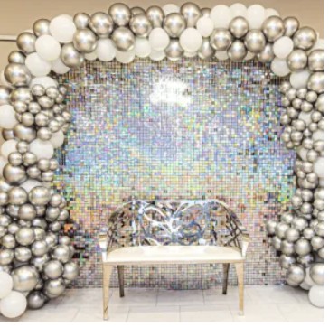 Balloon arch with sequin backdrop and gold bench