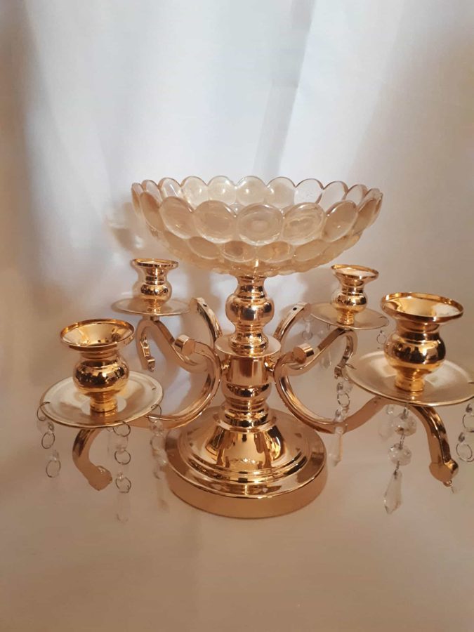 Gold candelabra with glass bowl